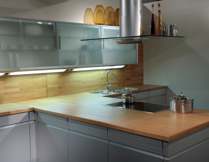 butcher block top in a modern, L-shaped kitchen